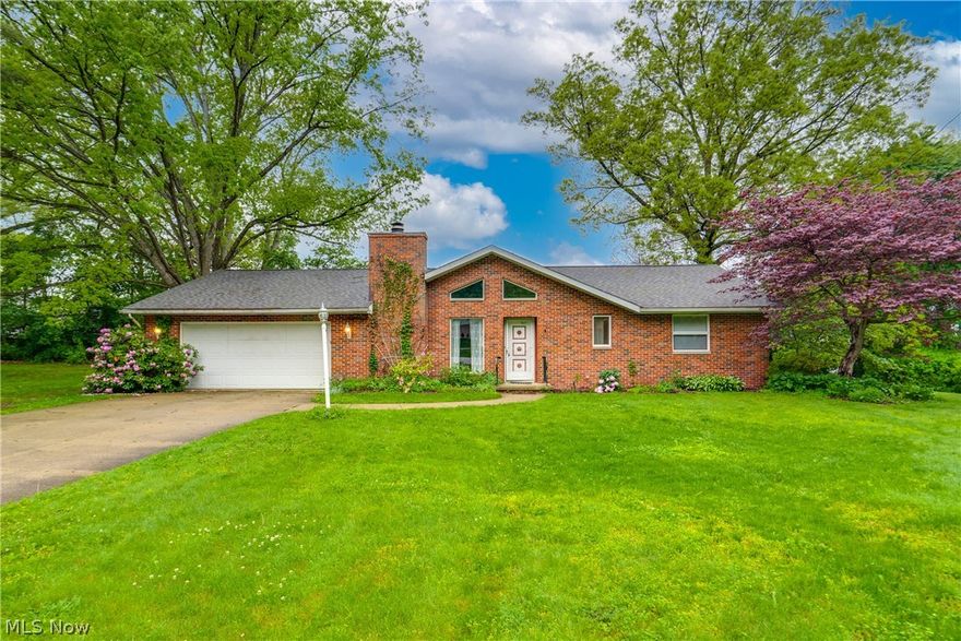 Discover Unlimited Potential in the Heart of Portage Lakes!

Seize the opportunity to own this classic ranch home in a highly desirable neighborhood. Situated on a generous lot, this property offers the perfect canvas for those looking to add their personal touch and restore a home with truly "good bones." It is a rare chance to secure a home in a prime location and transform it into your vision.  Upon entry, you are greeted by an inviting living room highlighted by vaulted ceilings with exposed beams and a cozy fireplace. The layout flows into a tiled kitchen featuring a large center island and a convenient laundry closet. Adjacent is a bright, tiled dining room, followed by an expansive secondary family room. Designed for entertaining, this massive space boasts soaring vaulted ceilings, quality custom built-in shelving, and a wet bar. Sliding doors open from here to a private back deck, seamlessly blending indoor and outdoor living.
 The private wing of the home features three well-proportioned bedrooms, including a primary suite with a large walk-in closet and a private en-suite bath with a double vanity. A second full bathroom serves the home, and an attached two-car garage provides easy, direct access. While this property invites some TLC to polish its character, the solid construction and thoughtful layout make it an exceptional investment. Don't miss this opportunity—schedule your private showing today!