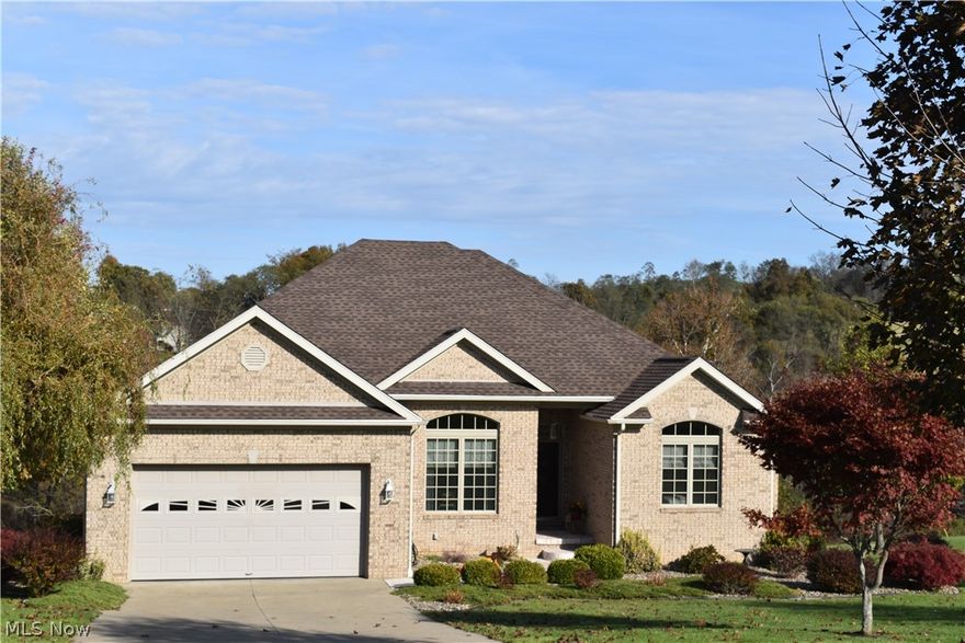 Walking through this gorgeous 4 bedroom, 3 full bath home you will see many customize features on both the first floor and wonderful finished basement. You will find lovely fireplaces in both the first floor and basement with gas logs. The large master bedroom has a special tray ceiling, walk-in closet,  plus a view through the arch way of the master bathroom with a jetted tub, separate shower, and cabinets with soft close features. The outstanding open floor plan begins as soon as you enter with a special view of dining room, kitchen, and living room. In the kitchen you will find Kraft Maid cabinets with soft close features. The home also has six panel doors and luxurious crown molding. Walk down the beautiful open staircase to the basement area which would make a wonderful in-law suite with it's large complete bath, bedroom, and terrific rec room with gas log fireplace. Nice garage sized workshop in the basement as well as plenty of storage. The home also has a very nice two tier dec