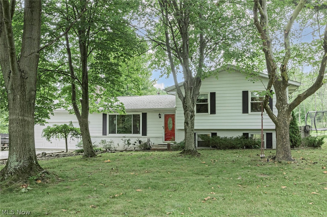 Welcome home to this picturesque setting on almost 2.5 acres! This 3 bedroom, 1 1/2 bath home has many updates! Your first floor features hardwood floors throughout with wood burning fireplace and wood burning stove. The vaulted ceiling family room has large picture windows allowing for great natural light. The kitchen is nice and open with newer gas stove and kitchen island. The lower level features a rec room, laundry room and half bath. Walk out the slider doors to the inviting deck with pergola, great entertaining space! Continue out back to the 2-stall barn and 2 paddocks. The wooded backyard also includes walking trails lined with blackberry bushes. Updates include: new water softener/reverse osmosis, new carpet on 2nd, hardwood floors, newer washer/dryer, newly renovated full bath, new roof on barn, crawl space waterproofed and many more! Interior pictures coming soon.