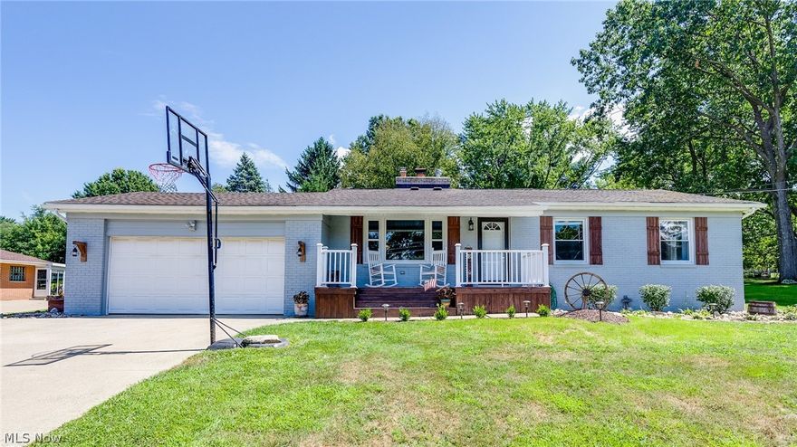 Location, location, location...in a home that is unique, updated and underrated! This adorable 3-bedroom, 2-full bath home on a dead-end street in a quiet Tallmadge neighborhood also has two bedrooms in the basement. And where do we begin with this creative home...with all the add-on's? Check out the HGTV-style living room fireplace that has been updated in the midst of vaulted ceilings, with a Century-old barn mantle...ready to use as a wood-burning unit. And on the BACK of the fireplace? There is a compartment used for storage, but it was once a built-in pizza oven - it just needs to be converted back! The dining room/kitchen features LVT flooring, and the area makes use of estate-sale items for hanging kitchen items (see photos). This home has a remodeled first-floor bathroom, with a ceramic tile shower and a French-style vanity...a Master bathroom with an en-suite full bath. The 4-season sunroom features Nature Stone flooring, a built-in gas fireplace and casino games (negotiable,