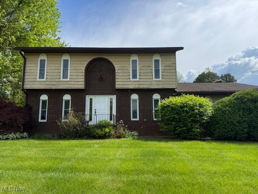 This classic 2-story home in Oakwood North has 4 bedrooms and 2-1/2 baths, a fireplace, attached garage and a second lot for a total of 2/3 acre!