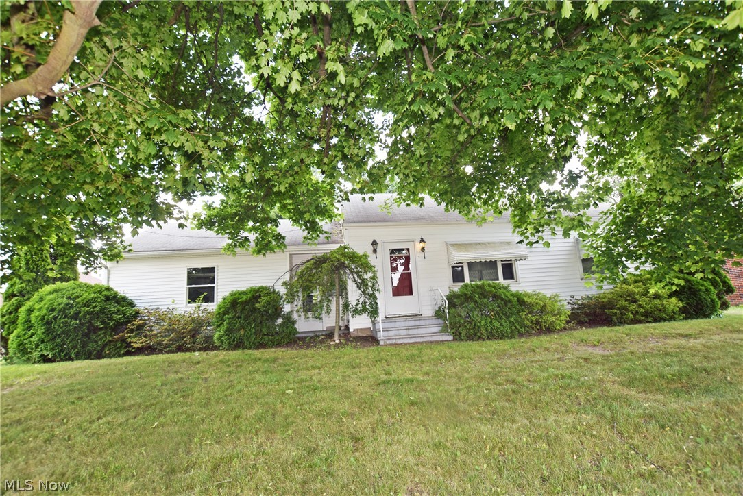 Surprisingly large Kitchen and Living room. Rear entry garage off of side street still leaves plenty of back yard space. All appliances can stay including the stair lift or seller can have removed if you wish. Kitchen renovation about 15+ years ago. Windows are vinyl replacements. Seller is providing an America's Preferred Home Warranty for your peace of mind.