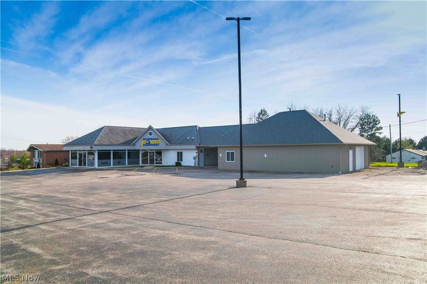 Fantastic opportunity to own this high traffic location with frontage and access on Pearl and Grafton Rd. The main building is 2,744 Sq ft. which includes a showroom with large windows, office, breakroom, bathroom,  a 576 sq ft. heated service bay with a 14' x 8' garage door.  
A 1,575 sq ft heated service garage addition with 12’x 12’ garage door and with a private office was added in 2017. A 20 ft. Breezeway connects the two buildings.
The approximately 27,000 sq ft paved parking lot has new LED security lighting and can park approximately 50 vehicles. Only 1/2 mile from Strongsville and highly visible with traffic light at the intersection.  This property has been well maintained, clean and ready for the next business opportunity. Call today for more information