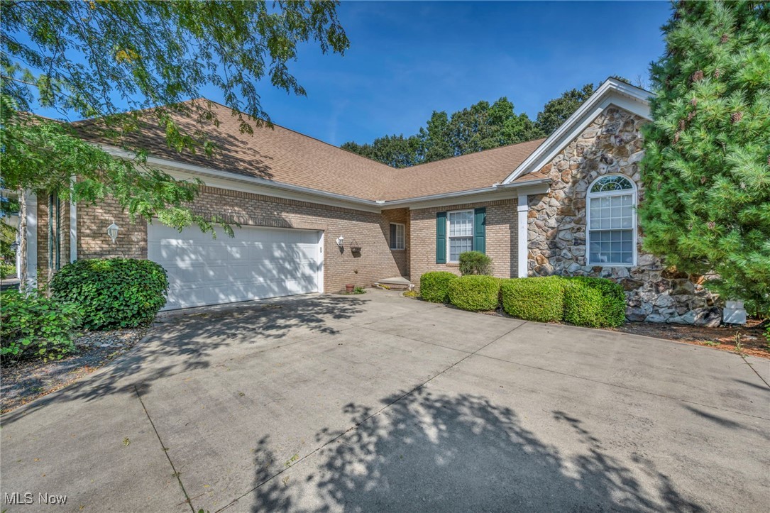 Premier Ranch Home in Waterbury Subdivision! Magnificent custom-built brick/stone front ranch offers exceptional design, quality construction, and timeless appeal. Featuring an oversized side-load garage w/nature stone flooring, abundant storage, & beautiful roof lines w/2002 dimensional roof. Inside, soaring 10’ ceilings, eye-catching 8’ interior doors, & magnificent windows create a light-filled, open feel. The smart, single-floor plan includes a spacious first-floor laundry w/granite top sink and cabinets for added convenience. Heart of the home is the gourmet 42” kitchen w/granite counters, center island w/breakfast bar, & abundant cabinetry—perfect for any cook. Massive great room showcases a custom raised-hearth floor-to-ceiling brick fireplace. A double-door entry leads to the impressive owner’s suite, complete with glamour-style including all the amenities bath plus enormous walk-in closet. Enjoy the premium treed backyard from the oversized 3-season sunroom w/paver flooring or relax in the hot tub just outside. Additional features include a whole-house generator, newer central air, 2017 hot water tank, sprinkler system, & large basement for storage or future expansion. Elegant, spacious home was constructed by one of the community’s premier builders w/no expense spared. While some cosmetic updates may be desired, the value, layout, & quality of construction make this a rare opportunity. Home, appliances, and hot tub are being sold as-is. Don’t miss your chance to own one of Waterbury’s finest homes!