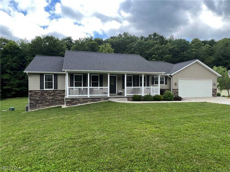 Immaculate 4 bedroom, 3 bath stone and vinyl home.  Open floor plan.  First floor laundry.  Spacious master suite.  Walk out lower level.  Peaceful country setting with over 2 acres just outside of town.  Quality built by Schlabach Builders.