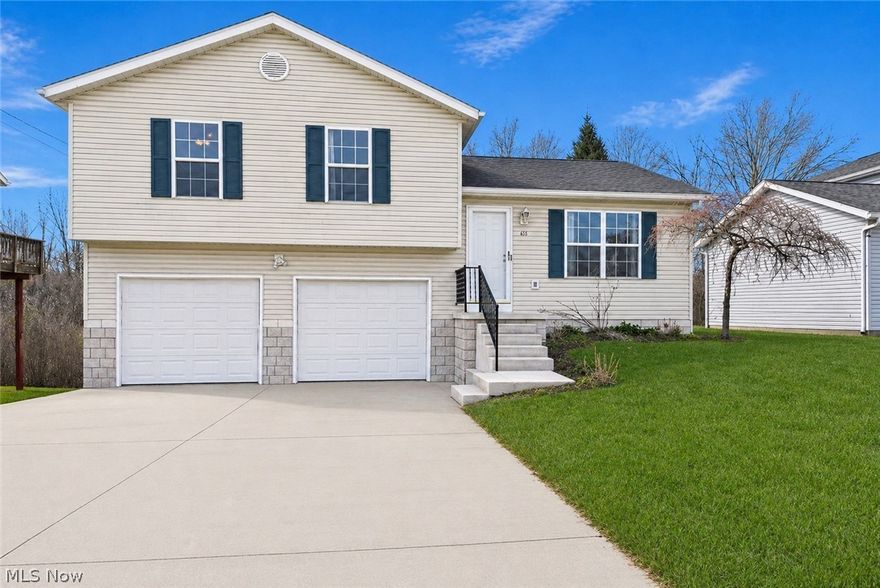 Welcome to this well-maintianed 3 bedroom, 1 full bath and 2 half bath home in Ravenna!  Upon entering the home you're greeted by an open, spacious layout.  The main level has vaulted ceilings and plenty of natural light highlighting a large living room, with new carpet, flowing seamlessly into the kitchen.  The eat-in kitchen has plenty of cabinets for storage and stainless steel appliances.  With sliding glass doors leading out to the back deck, the space is ideal for both entertaining and everyday living.  Upstairs are three well sized bedrooms, including a primary suite with its own half bath, walk-in closet and access to a full bath.  The lower level has another half bath, the laundry facilities and walk-out access to the backyard.  There is plenty of additional/storage space in the basement and ample parking space in a two-car garage.  With a great Ravenna location and plenty of recent updates, this home is move-in ready and awaiting it's next owner.  Schedule your private showing today!