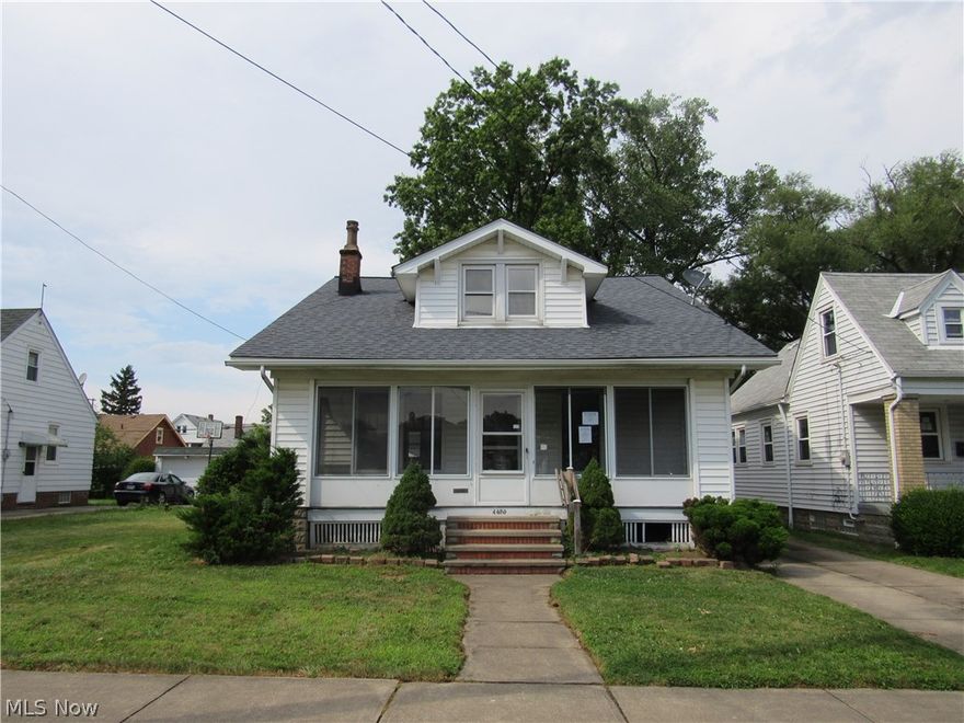 Spacious Old Brooklyn bungalow with 4 bedrooms!  Living room has a brick fireplace as its focal point! Eat in kitchen!  Two bedrooms down with full bath, along with two bedrooms up with another full bath!  Enclosed front porch!  Central air already there!  Oversized 1 and a 1/2 car garage, plenty of room for storage!  Plus a full basement for additional storage!  Street dead ends into the community park!  Needs your decorating ideas!  Call today before it is gone!