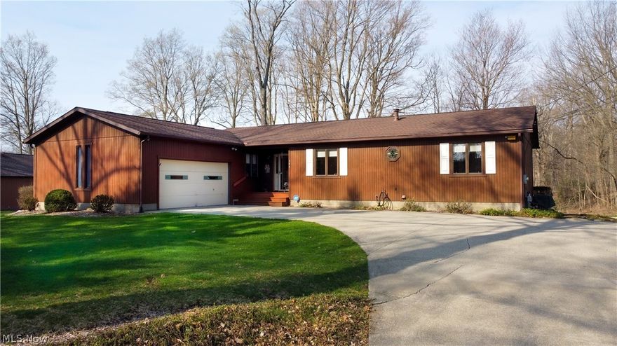 Ranch living on nearly an acre! Meticulously maintained 3 bedroom with 2 full baths, all on the 1st floor. Spacious eat-in kitchen includes ALL appliances (stove, fridge, microwave, dishwasher), plus basement laundry includes washer/dryer. Dining room off the kitchen features sliders to a large screened porch . Living room includes a fireplace. Even more living area in the basement with a finished rec room. But the truly spectacular feature of this home is the 30'x40' outbuilding, complete with 2 enormous overhead doors, heater, hot/cold water, and air compressors, could easily fit trucks, toys, 4 or more cars, etc. Other features: nearly 1 acre, serene setting, attached 2-car garage, multi-level deck, conveniently located near freeways and just minutes to Akron or Cleveland.