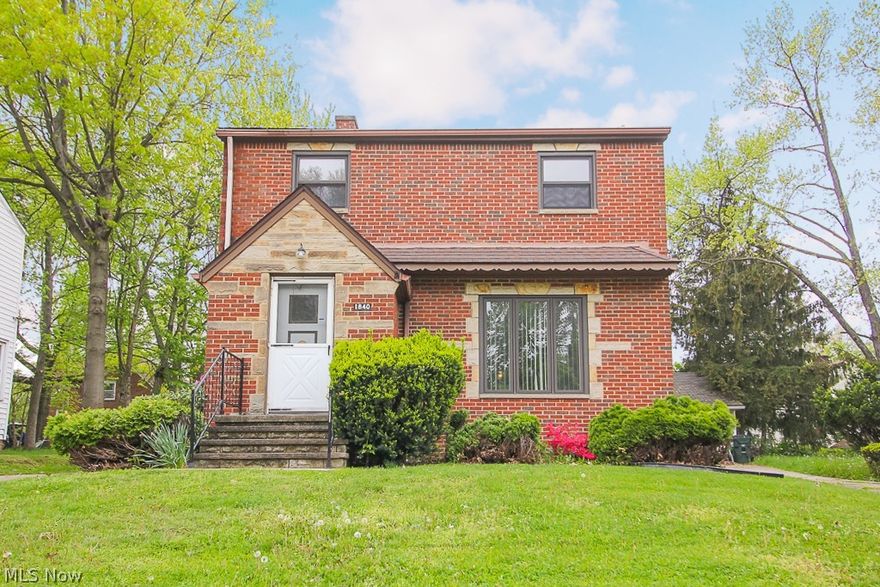 This beautifully renovated Euclid colonial is a stunning find that you won't want to miss out on! You'll fall in love at first sight with the distinctive brick exterior, unique stone accents and professional landscaping. Continue inside to find a home with even more to love, like the fully restored hardwood floors and woodwork that gleam in the natural light. The large living room features a stylish stone fireplace and large picture window and flows into the formal dining room with beautiful corner china cabinets and access to the rear sunroom that overlooks the backyard. The updated kitchen is spacious and lined with lovely oak cabinets that offers plenty of storage, plus new flooring and fridge, wall oven, range and dishwasher! Upstairs you'll find 3 large bedrooms, each with more beautiful hardwood floors and their own closets, as well as the full bath. Plus, this home offers a partially finished basement, giving you space for the perfect rec room or even home office, as well as a l