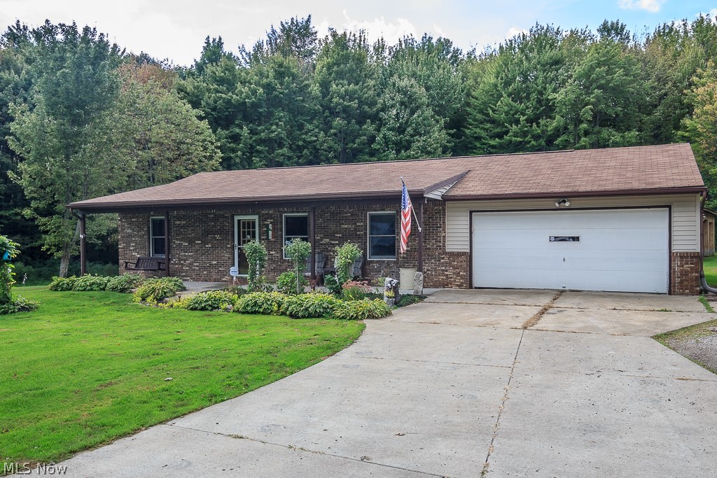 Enjoy your own private retreat on 7 acres in Thompson! This 3 bedroom ranch has an open floor plan and has been freshly painted.
The vaulted great room with laminate flooring and a stone wall is the perfect place to entertain guests.
Enjoy the outdoors in the four seasons room with a cozy fireplace heating unit, Nature Stone flooring, and a door out to the concrete patio.
Open Eat-in Kitchen features bar-top seating, new (2017) black stainless steel appliances and newer ceramic tile flooring.
The laundry room also has newer ceramic tile flooring and the washer and dryer stay!
The master retreat is separated from the other bedrooms and has a large walk-in closet and a remodeled full bath in 2017. There are two more spacious bedrooms and an additional full bath that was also completely updated in 2018!
There is a 2 car attached garage and a large cedar sided pole barn that can fit at least two cars or is perfect for a workshop or additional storage. There is also loft access and e