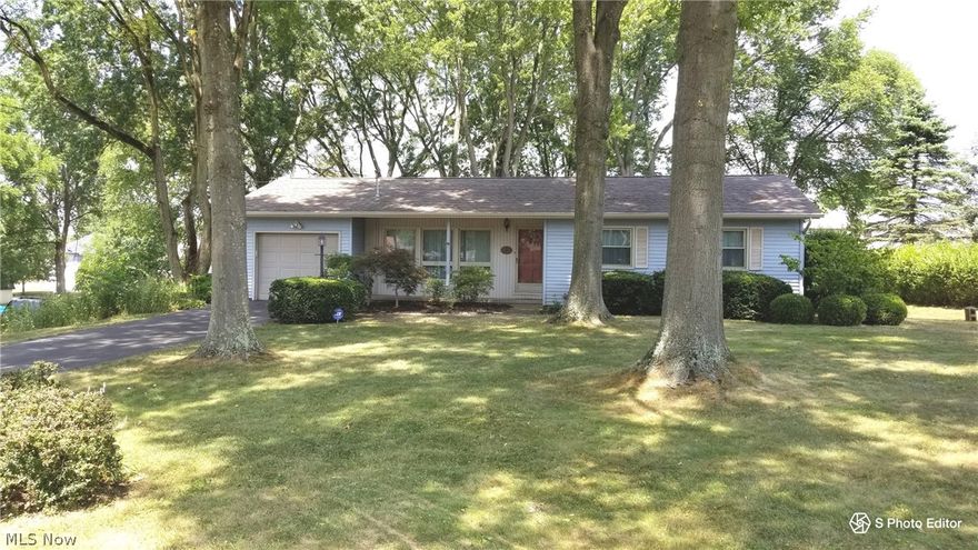 A park like yard sets the stage for this solid 3 bedroom, 1 1/2 bath ranch, and it's  waiting for your personal touch! Many updates previously included siding, windows, glass block windows,  roof (2004), furnace and central air (about 2010) and updated electric breaker box. Gorgeous hard wood floors are beneath the carpet in the bedrooms, hallway and closets. Enjoy the warmth of the wood burning fireplace in the winter and appreciating the view from the 3 season room when weather permits. One attached garage is  on the main level and the second is on the lower level on the West side of the home which includes a walk out to the side yard. The shed in the backyard also remains with the property. New septic system to be installed in September by the sellers. Culligan Water Softener is currently leased, $57.81 a month. 
Taxes of $1996.00 annually include a Homestead Reduction of $455.24 a year. Property is being sold in As-Is Condition.