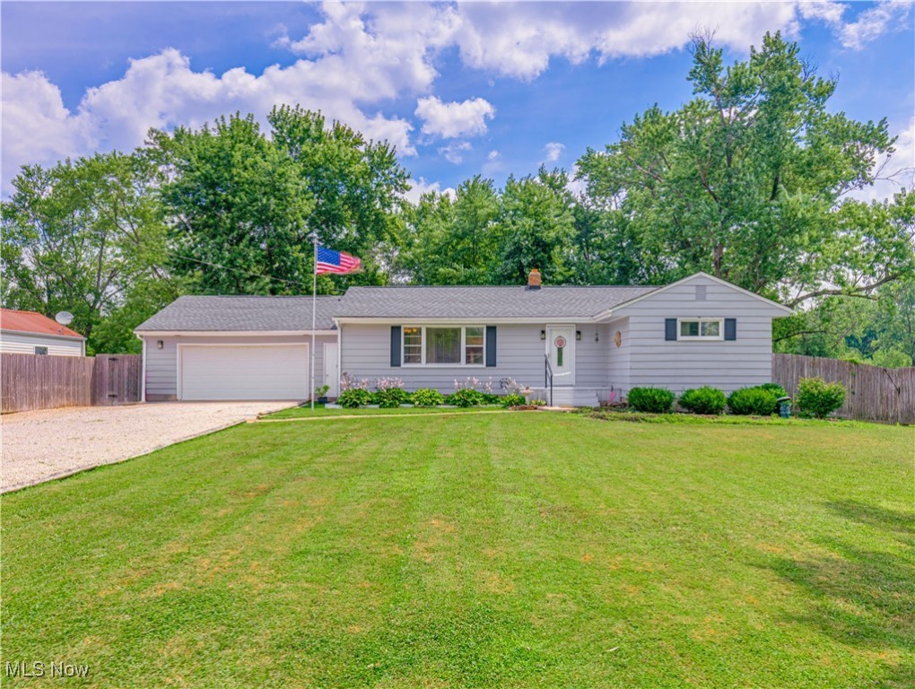 Welcome to 2985 Carl Street in Norton! This delightful 3-bedroom, 1-bath ranch offers over 1,300 square feet of inviting living space in a quiet neighborhood setting. As you step inside you will discover a spacious living room, a beautiful kitchen, a bathroom and 3 comfortable bedrooms. Off of living room you will find an additional large living area which has access to the backyard and is perfect for entertaining, a home office, or flex space to suit your lifestyle. Enjoy summer evenings on the backyard deck, overlooking a fully fenced yard ideal for pets, play, or hosting get-togethers. The 2 -car garage is spacious with a workshop, laundry area and convenient access directly through the home. The carpet is brand new, roof installed 2024 and furnace is newer as well. The basement is full and offers plenty of storage area. Don’t miss out! Schedule a showing today!