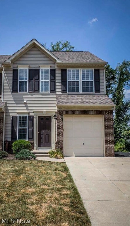 Welcome to luxury living in the Weatherstone Village of Cuyahoga Falls. This modern townhouse has all the high end features of stainless steel appliances, top tier granite and contemporary tile-work coupled with all the warmth of textured maple hardwood floors and a feature wall of windows showcasing the wooded view. Truly an open floor plan, this custom layout was made for entertaining and aesthetic flowing seamlessly from the foyer to the walk out deck of the dining area. Just a few of the many upgrades here are walk in closets, tray ceilings, recessed lighting throughout, all modern fixtures, marble tile custom floors, garden soaking tub in master suite, "soft-shut" custom kitchen cabinetry and an additional 660 square feet of finished basement space with an attached full bathroom. Come see how sweet the good life can be here at 1250 Wellingshire Circle, call today for your private showing!