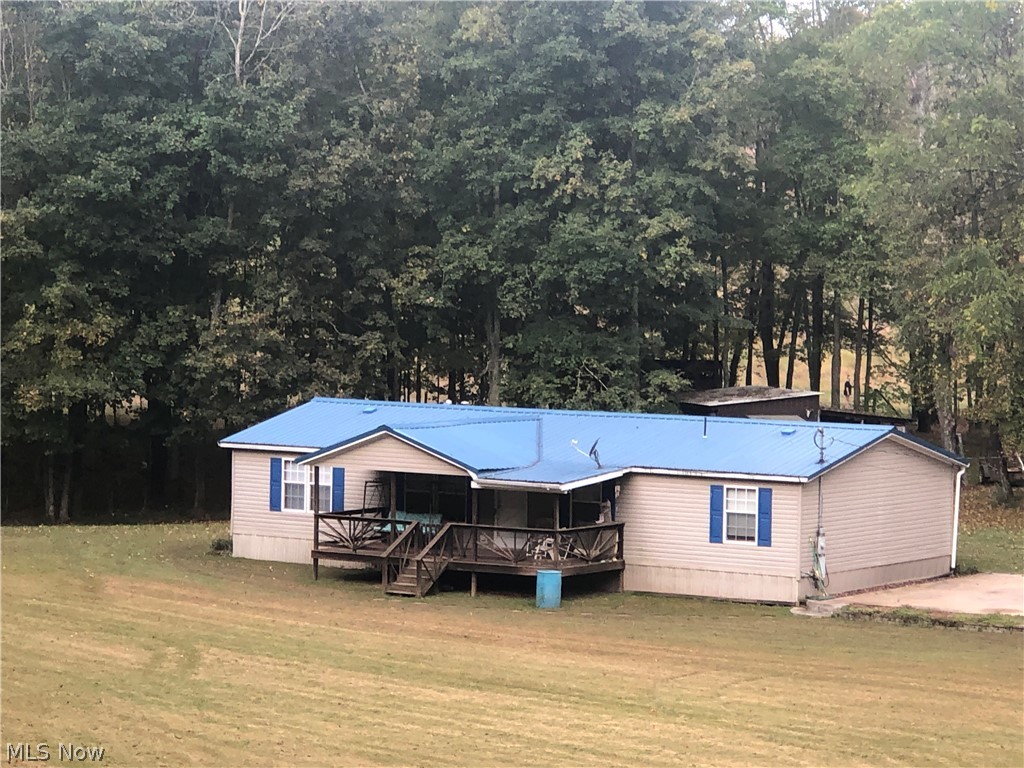 Come see this well maintained double wide with a beautiful yard that any family could enjoy. This home features 4 bedrooms with 2 bathrooms, a play set in the yard ready for the kids, and 7 sheds/outbuilding/etc. for plenty of storage room.