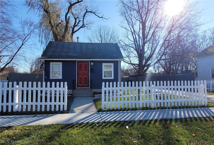 Adorable 2 bedroom 1 bath ranch home on a wood fenced lot with a stunning wheeping willow tree. Brand new driveway leads you into the 2 car garage, plenty of work space area. New deck off kitchen offers plenty of privacy in this completely fenced back yard. As you enter the front door enjoy the sun porch then another secured door leads you into the large living room with original solid oak floors. Nice size kitchen includes all appliances, laundry room complete with washer and dryer. Full bathroom with new granite countertop. Beautiful wood deck off kitchen. 2 bedrooms with additional attic storage and small bonus room in the front bedroom. Rear wood deck leads down to the partial basement with hot water tank and gas furnace. Must see this cozy home minutes to Ohio Turnpike and Route 2. Only 35 minutes to Cleveland. Minutes to shopping and restaurants.