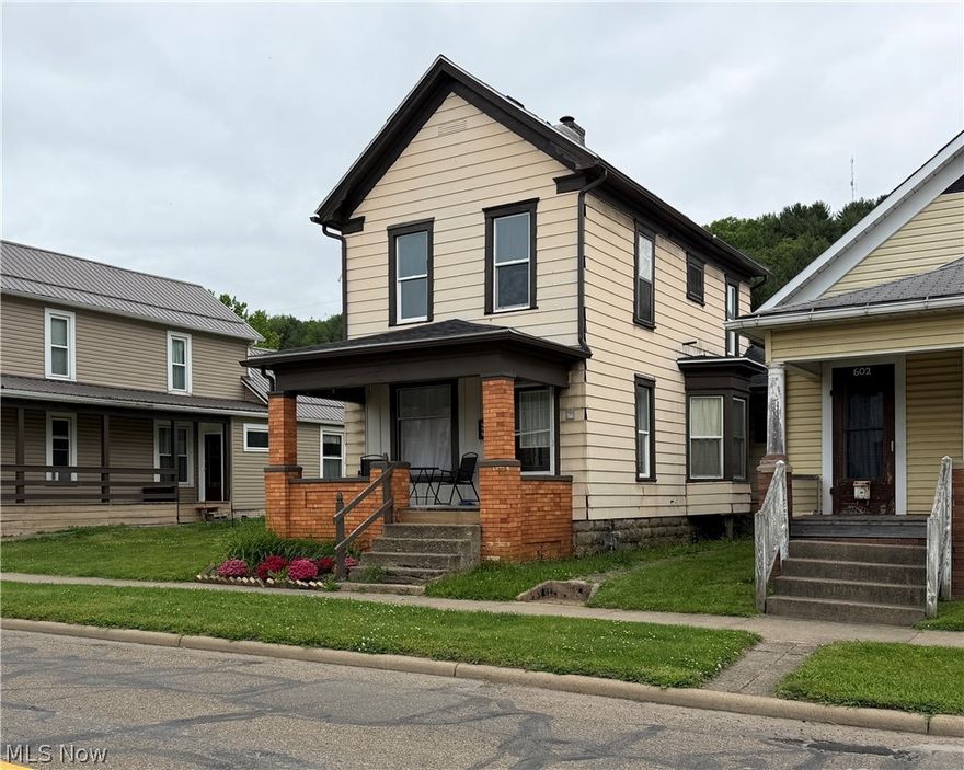Conveniently located in the heart of Dennison, this charming 2-bedroom, 1-bath home combines classic character with modern updates. The interior offers a bright, refreshed feel with updated flooring, neutral paint colors, and a practical main-level laundry/mudroom setup. Several big-ticket improvements have already been completed, including replacement windows, an updated furnace, and a newer roof and central air system installed in 2023. Outdoor spaces include welcoming covered porches on the front, side, and rear of the home, while the rear alley access provides additional off-street parking options. A great opportunity for anyone looking for an affordable home with updates already in place and easy access to local amenities and highways.