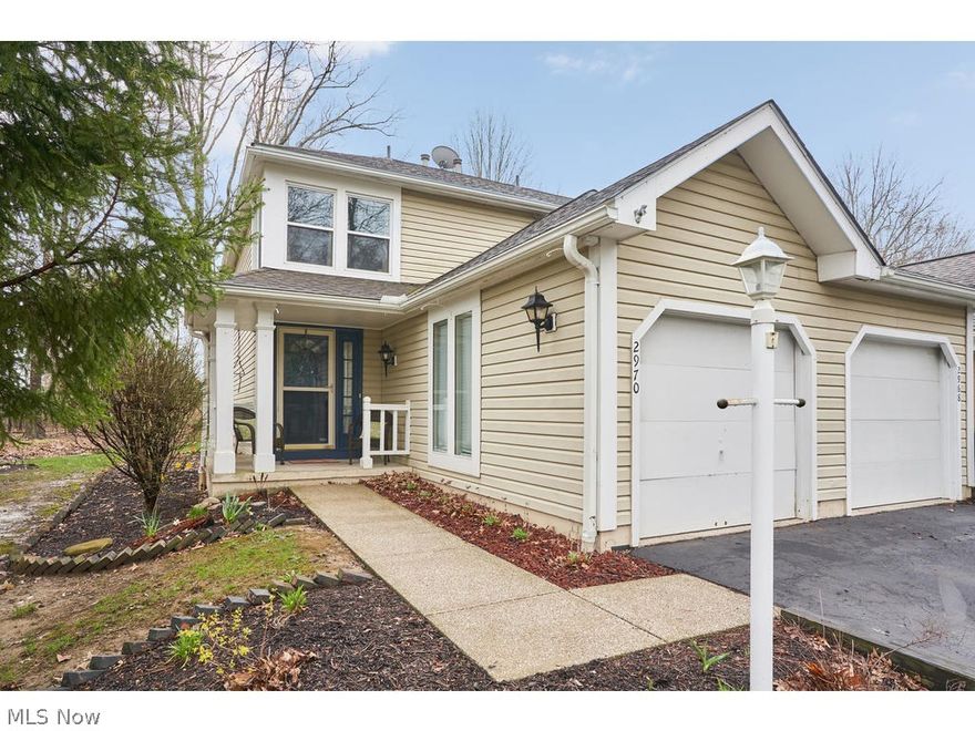 This is the perfect answer to low-maintenance living!  Fresh, clean and ready to enjoy - this two-bedroom, two-bath condo in the desirable Woodland Lake subdivision has received updates too numerous to count.  The kitchen has newer stainless steel appliances, including a gas range, a French-door refrigerator, range hood and dishwasher as well as a new tile backsplash.  The bedrooms have new windows and are a peaceful retreat from your busy days. From the large living/dining room you go through the sliding door to the private patio with updated landscaping and a peaceful wooded view.  The lower level features a finished, carpeted family room, your laundry room and ample storage.  Have peace of mind with your newer furnace (2016), water purifier (2016), sump pump (2016), and NEST thermostat (2016).  Approximately a 12-minute drive from Kent State University and 20-minutes from the University of Akron.