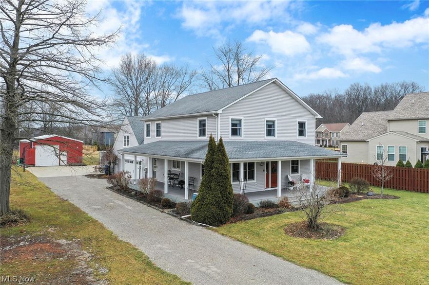 This beautiful home will WOW you!!  Situated on 1.25 acres, this farm house features a charming wrap around porch (Trex) for calm/serenity now morning coffee and two entryways that bring you to the open eat in kitchen living room area and tons of cabinetry storage and pantry area.  Further Primary floor amenities include First floor laundry with sink and folding area, first floor bedroom/office with beautiful natural lighting and large formal dining area to further entertain your guests!!  The upper level will win you over with FOUR large and lovely bedrooms and large upper level landing with sizable linen closet and remodeled full bath. The Primary Suite with glamour bath features dual sinks and updated tiling/sitting area to change clothes and plenty of cabinetry storage. There's more!!!  What about the upper level unfinished walk up area from garage that can be accessed to the main house if remodeled AND the gardeners/workshop room off the garage to get you started on your spring vegetable gardens/flowers OR the 24x32-foot barn with concrete floor for your further gardening tools or storage of boat/equipment OR make it a shabby chic work space, he/she shed or art studio...the world is your oyster here!!  Lot goes way beyond barn and perfect for gardens/perenials!!