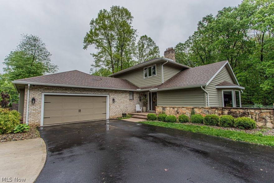 Welcome to this immaculate, turn-key residence offering the perfect blend of modern upgrades and an unbeatable location which is  close to everything but still feels private! Nestled on a lush 0.53-acre lot in Boardman Township and within the Canfield Local School District, this beautiful 3-bedroom, 3-bathroom conventional home enjoys a rare, highly private setting directly adjacent to Mill Creek Park.

Step inside to a bright, open interior featuring sleek vinyl plank flooring, a fresh coat of paint, and newly updated lighting and electrical fixtures throughout the home's spacious 2,928 square feet of living space. The custom kitchen is a chef’s delight, showcasing elegant granite countertops, premium cabinetry, and a full set of stainless steel appliances updated in 2022. All three bathrooms are full baths, highlighted by a luxurious master bathroom fully remodeled in 2023, complete with an adjacent custom closet organization system installed in 2021.

The partially finished lower level provides a versatile spare room with gas fireplace. A new sump pump with a battery backup system was also added in 2026. The BRAND NEW air conditioner was installed May 2026. 

Major capital improvements have already been meticulously completed for you, including a new roof, gutters, downspouts, and exterior paint (all in 2021), as well as high-end, energy efficient Pella Impervia windows (2021). The exterior also features fully updated drainage with French drains (2020) and a brand-new driveway (2022).

The outdoor space is a true garden-like oasis. Extensive professional landscaping with beautiful stone accents surrounds the property, while the ultimate outdoor entertaining setup awaits on the 20x20 stamped concrete patio. Want some fresh eggs? Raise your own flock of hens in the chicken coop!

This meticulously maintained property offers an unmatched combination of modern comfort, structural longevity, and park-side living. Schedule your private tour today!