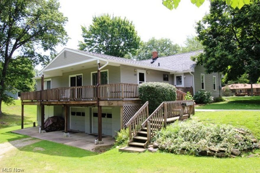Outstanding value in Tallmadge on picturesque 1.34 acres offering a beautifully updated & maintained 3 bdrm, 2 bath ranch w/1632SF (main level)*Living room w/2 sliders to partially covered deck, wood floor & see thru wood burning fireplace w/gas starter* Family room (w/see thru wood burning fireplace w/gas starter), sky light, slider to deck & built in cabinets* Updated oak kitchen w/ceramic back splash, pantry, gas range, dishwasher, refrigerator & disposal* Breakfast room w/fan & access to screened porch* Formal dining w/fan & wood floor* Bedrooms w/wood floor & fan* Updated bath* Screened porch* Walk out lower level w/full bath & access to attached 2 car garage & huge workshop/utility room w/double door access to outside partially covered wrap around deck* Updated breaker box, 95% efficient furnace (approx. 2010)* Shingles & siding (approx. 2012)* Most windows updated (not incl sliding doors)* Lovely rolling 1.34 acres w/creek* Open, spacious, light & bright!