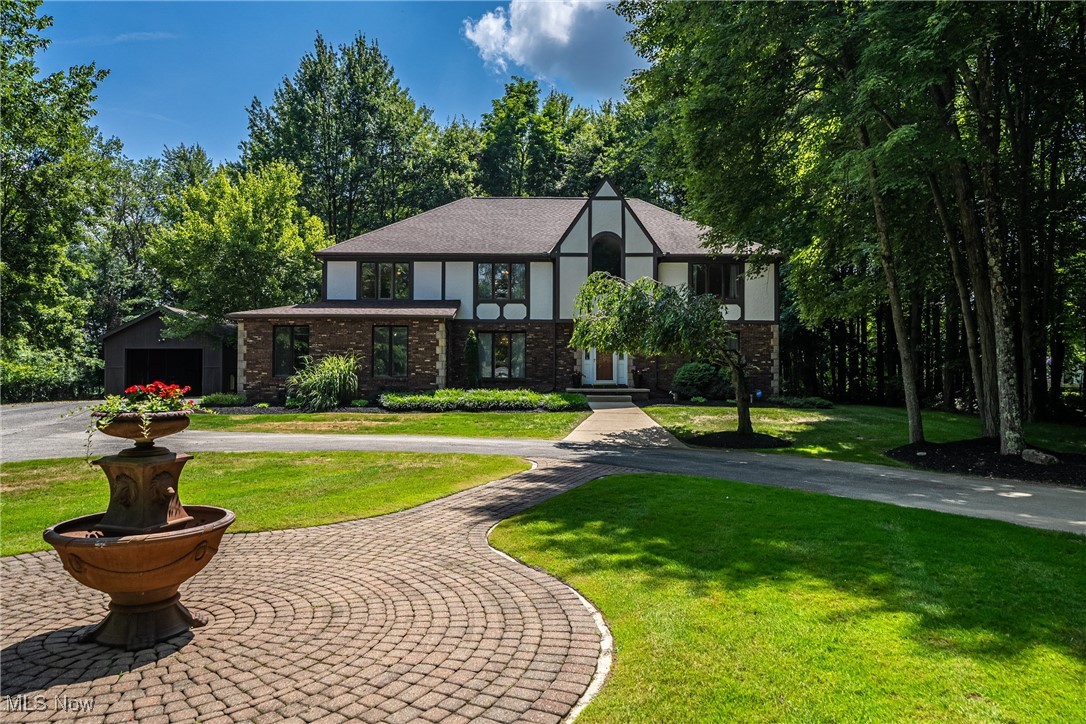Situated on 2.57 acre property with circular drive, and a private, park-setting for a backyard this lovely home is a unique gem! The spacious 3544 sq. ft. home features 4 bdrms, 2 1/2 baths, a finished basement, and 3-car garage with heater. There's huge separate, storage/outbuilding, with electricity that can be made into a workshop, carriage house, or used as additional storage or to park additional cars, trucks or oversized vehicles, or as another outdoor entertaining space. The inviting interior has a foyer that’s open to the living room and dining room. The living room also opens to the family room with a hearth fireplace. Just beyond the family room is the sunroom/3 season room with skylights, a beam, ceiling fan, LTV flooring. There is a 1st floor office with built in shelving with access to deck #2. The kitchen is equipped with a 5-burner gas cooktop island, coffee bar, stainless appliances, and dining area, with access to an enclosed porch off the kitchen and deck #1. The second floor has a large Primary bedroom w/tray ceiling, ceiling fan, sitting area, dressing area w/vanity, 2 walk-in closets and a dry sauna! The bath has separate shower and jetted tub, skylight, double sinks, and ample storage. A beautiful, updated 2nd floor laundry room has a sink, counter top, and LTV floor. The hall bath is also updated with LTV floor, a tile surround tub/shower, double vanity and storage closet. The finished basement offers additional living space: a tv area and room a pool table and dining space. A room perfect for a workout room, playroom, craft office and a large storage area completes the basement. The Park-like, private back yard is beautiful with mature trees and offers 3 deck areas, a paver patio, fire pit and hammock area, gazebo, swing set, picnic table area plus full tennis court, which can also be reconfigured to a pickle ball court, or full basketball court. There’s room to install for a pool too, if desired! Click reel to watch aerial video