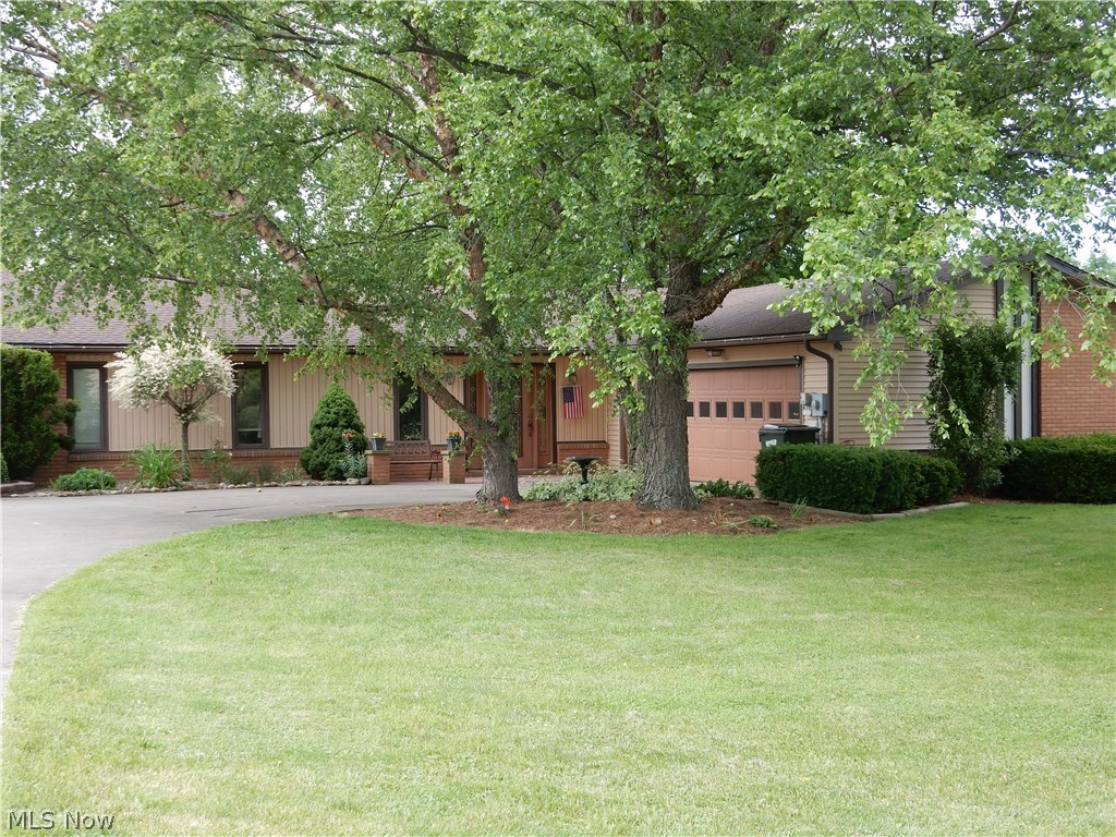 Beautiful and spacious, both inside and out. You will fall in love with this well kept and updated sprawling ranch home. If privacy is what you are looking for, you have found it. Situated on 2+ acres, well off of the road and in a nice little neighborhood. This home has much to offer that growing or grown family. You will love your new tremendous Great room with vaulted ceiling broken up by a secluded sunken living room. Enjoy the ambiance of the see through fireplace in both the dining room and great room. The suite living area will be perfect to locate your master bedroom away from the kids' rooms or house the in-laws in their own mother-in-law suite. Your new home also boasts a large deck for summertime entertaining and a 3 season Florida room. For the man in the house, the attached 2 car garage is over-sized and has plenty of workshop space while still parking two cars inside. You will also enjoy the 1st floor living and laundry. The basement also adds perfect room for storage