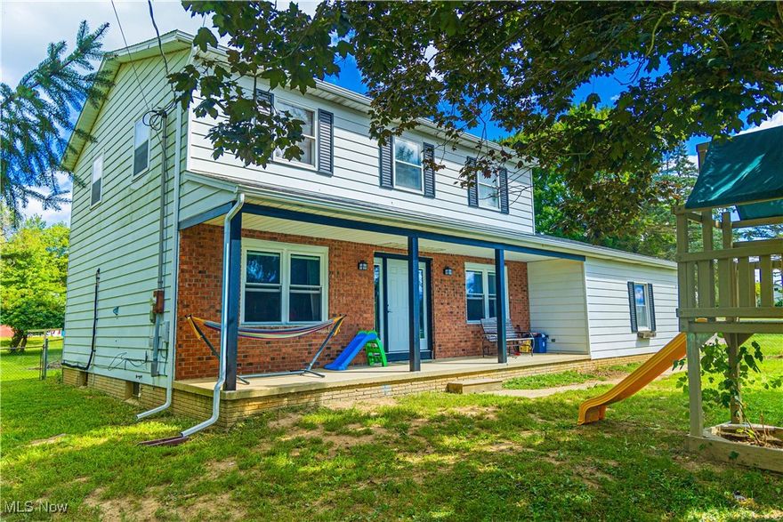 Country living transcends with this updated 4 bedroom Colonial situated on 2.72 acres! The spacious front porch welcomes you, featuring a new front door with sidelights allowing natural light to flow into the foyer. Natural light continues throughout the entire main level with updated, lifetime warrantied windows (transferable). The generous living room, boasting fresh paint & updated ceiling fixture, flows nicely into the fully equipped kitchen w/dining area, featuring all stainless steel appliances, upgraded cabinetry, updated flooring, new ceiling fixtures & fresh paint. The family room, boasting a beautiful brick fireplace & tray ceiling, leads out to the cozy sun room where country views & relaxation abound. The main level also provides a formal living room which can be used multifunctionally as an office or sitting area & updated half bath. An abundance of space & functionality continue to the second level providing 4 expansive, freshly painted bedrooms with ceiling fans/fixtures and a commodious full bath. A full, professionally waterproofed basement provides ample storage & presents a blank canvas for opportunity & creativity. The ductless heating & cooling system was updated in 2018, new HWT in 2019 & new roof, fascia boards & gutters were installed on the home & outbuilding Feb 2025. The exterior featuring 2.72 acres will not disappoint when it produces pear & peach trees, as well as 2 different types of grapes. Additional multifunctional opportunity is extended with 2 outbuildings and extra parking. A fenced in area is provided for convenience and practicality. Schedule your showing today!