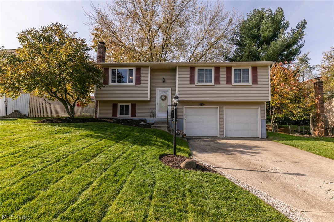 Warm & Welcoming, this inviting 3 bedroom, 1.5 bath home is sure to please! The foyer takes you up to the lovely living room w/ plush carpet & fresh neutral paint, and opens to the spacious eat-in kitchen w/ ample wood cabinetry, plenty of prep space, included appliances & dining area w/ slider that leads out to the sprawling deck & beautiful fenced in backyard w/ firepit to enjoy! Back inside, there are 3 comfortable bedrooms & a nice, full main bathroom that finishes off the main level. The lower level is complete with a family room w/ cozy wood burning stove, convenient 1/2 bath, laundry room w/ washer, dryer & utility tub & access to the 2 car attached garage. Important updates include: entire home painted and re-carpeted in 2017, Internal doors replaced/upgraded in 2018, Furnace & A/C(2013), Hot Water Tank(2013), Roof(2012), plus a 1 year home warranty is provided! Welcome home!