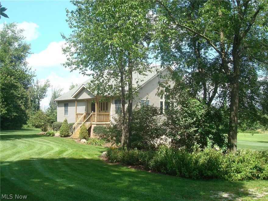 Custom built by original owner.  Picture perfect home, situated on 7.5 secluded acres!  Desirable open floor plan features vaulted or cathedral ceilings on main floor.  Mahogany flooring, solid wood doors and extra wide trim, plus beautiful Atrium window in the great room and corner fireplace.  Kitchen is fully applianced, with Granite counters, Maple cabinets, a walk-in pantry and center island w/breakfast bar.  Spacious master suite with 16' vaulted ceiling and a small loft.  First floor bedroom, bath vaulted, with 14' and 16' ceilings.  Lower level walk-out includes a 4th bedroom with 10' ceiling and daylight window; huge rec room, utility and laundry area, and half bath.  There is access to the one car garage on one side, and access to the 4 car garage on the other.  The picturesque, winding driveway is asphalt and concrete.  Additional 16x21 out building, great for lawn equipment and storage.  Fabulous manicured lawn, landscaping and mature trees.  Truly one of a kind!