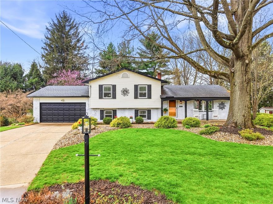 Welcome to this beautifully maintained 4-bedroom, 2.5-bath split-level home, perfectly situated on a quiet cul-de-sac and offering over 2,800 sq. ft. of thoughtfully designed living space. From the moment you arrive, the immaculate landscaping and charming covered front porch—featuring whitewashed brick and striking black shutters—set the tone for the modern curb appeal this home delivers. A spacious living room with gleaming hardwood floors that seamlessly flows into the dining area, creating an inviting layout ideal for both everyday living and entertaining. The kitchen is a standout, complete with stainless steel appliances, a stylish tile backsplash, and ample cabinetry and counter space to meet all your cooking and storage needs. The owner’s suite offers a private retreat with generous closet space and a full bath featuring a stand-up shower. Three additional bedrooms are well-sized and share an updated full bath with contemporary dark accents. The lower level provides a cozy yet functional space, highlighted by a built-in bookcase with storage, track lighting, and sliding doors that open to a bright and airy sunroom. This level also includes a dedicated office space, a convenient half bath, and a laundry area. Downstairs, the expansive basement offers endless possibilities—perfect for a recreation room, home gym, or theater—plus a utility room with even more storage. The sunroom is a true showstopper, surrounded by windows that overlook the beautifully landscaped backyard. With vaulted ceilings, a ceiling fan, and sliding doors on both sides, it provides easy access to both a concrete patio and a charming brick patio—ideal for relaxing or entertaining outdoors. A storage shed adds even more convenience. Located in the desirable Tallmadge School District and lovingly cared for by its original owner, this immaculate home is truly move-in ready and waiting for its next chapter.