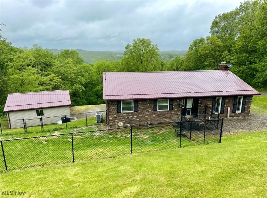 Don't miss the chance to view this 3 bedroom, 1 full and 2 half bath brick ranch home situated on a spacious lot with gorgeous views of the surrounding landscape. Major updates include a new roof in (2017), heat pump (2017), and windows updated in 2010 with a transferable lifetime warranty. The home also features updated doors (2014) and a fenced-in portion of the yard. Additionally, there is a detached garage behind the home for extra parking or storage. Call an agent today to schedule a showing!