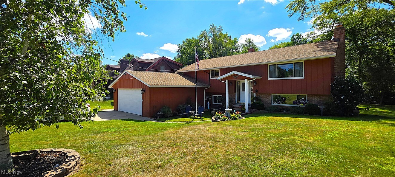 Beautifully updated and well-cared-for home featuring 4 bedrooms and 2 full baths. Enjoy the convenience of a first-floor bedroom and full bath, plus a spacious walkout lower level with a cozy fireplace in the family room. The home offers hardwood floors in the upstairs bedrooms and under the living room carpet, a recently updated kitchen, newer furnace, newer roof, and a 1-year home warranty for peace of mind. Major updates include new cedar siding (2023), exterior paint (2023), deck (2022) with new stairs (2024), gutter guards (2023), sanitary sewers (2024), and a Generac automatic whole-house generator (2024). Situated on over 1 acre, this property combines the feel of country living with the convenience of being minutes from shopping, restaurants, freeways, and amenities. A large deck off the dinette is perfect for relaxing or entertaining, and the private backyard features a two-story 352 sq. ft. barn/outbuilding with loft. Close to the Metroparks, this home offers the perfect blend of comfort, space, updates, and location!