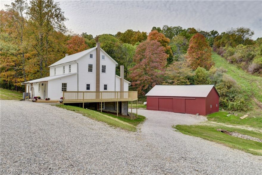 Take a look at this newly renovated farmhouse on 5.5 acres conveniently located minutes from US 36 in Uhrichsville. The main floor is an open concept consisting of a brand-new eat-in kitchen from top to bottom with custom cabinets, granite countertops, and new stainless-steel appliances. A master suite with a walk-in closet and new custom walk-in shower, living room and laundry with a half bath complete the main floor. Upstairs there are 3 bedrooms and a freshly updated full bath. The walk-up attic and unfinished basement provide lots of storage space. The mechanics of the home include all new utilities including electric heat pump furnace, central air, a brand-new high efficiency water heater and a new well and septic within the last 6 months. Attached to the home is a wrap-around porch allowing you to soak in the views from front to back. Rounding out the property is a 28x46 shop/barn ready for your equipment storage, garage use, or your animals and a creek that runs along the length of the property. The home is move in ready with clean hardwood floors throughout and modern updates already done for you. Don't miss your chance to buy this ultimate homestead!