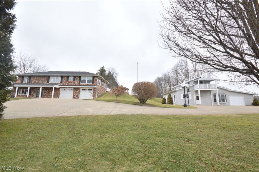 Welcome to 49248 Orchard Lane. You will be welcomed by the beautiful cement driveway that features Victorian light posts guiding you to your new home. This property is unique as it features 2 homes and one that would make a great rental or in-law suite. This all brick home features 3800 square feet of beautiful living space that features 3 bedrooms and 3 1/2 bathrooms. As you enter the home you will notice quality Anderson french doors, ceramic tile foyer and a large family room that features a gas fireplace, large picture window, and a wet bar. The lower level of the home also features an office, full bathroom, and a fully finished laundry room with custom cabinetry and a large storage closet. Entertaining is easy with large second family room that features built in entertainment center with custom display window perfect for the holidays or any hobby you want to display! On to the second floor you will find 2 large bedrooms, half bath and full bath. The dining room features a gorgeous
