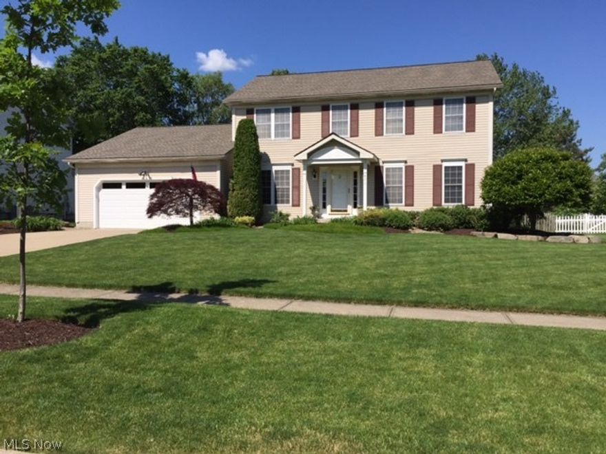 This large 5 bedroom 3 full bath home on over 1/4 acre
has a backyard that looks and feels like your own private park! A large Trex deck and pergola is great for gatherings
and lets you enjoy the landscaped scenery. There's a kid friendly island picnic area in the yard, and a quiet retreat
patio for personal time...and still.. open green space for games and fun!! Inside amenities include a large eat-in kitchen
with center island, a family room with brick fireplace, french doors that lead to the living room, and a formal dining
room. The first floor also includes a bedroom (with large closet), usable as an in-law suite or office space. There's a full
bath in this wing, along with a laundry room with access to the backyard. There are 3 nice size bedrooms upstairs, a
full bath, plus a Master Suite with walk-in closet and large master bath. The partially finished basement includes a rec
room area that's carpeted and has loads of built-in storage. There's also a craft/work shop area