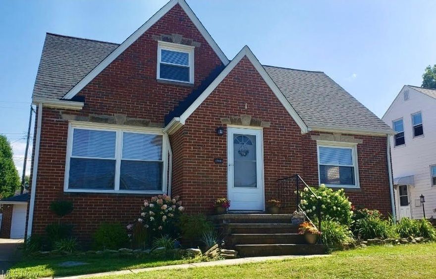 This move in ready, 3-bedroom, 2 full bath brick Bungalow/Cape Cod with 2 car detached Garage is a hidden gem sitting on a lot with mature trees in the heart of one of Parma’s most desired neighborhoods. This updated home boasts a beautiful eat in Kitchen overlooking the back yard, with newer cabinets, stainless-steel appliances, counters, and tile backsplash. Flowing off the Kitchen are the cozy Living Room, 2 large Bedrooms and updated full Bath all with fantastic natural light throughout. The 2nd floor Owner’s suite holds a cozy Office/Bonus Room and large Bedroom with full Bath en-suite. The lower level has glass block windows, throughout, a Recreation Room with bar and the Laundry/Mechanical Room with washer, dryer, updated mechanicals (Furnace 2015, A/C 2017, Hot Water Tank 2013) and electric panel. The home was waterproofed in 2017.