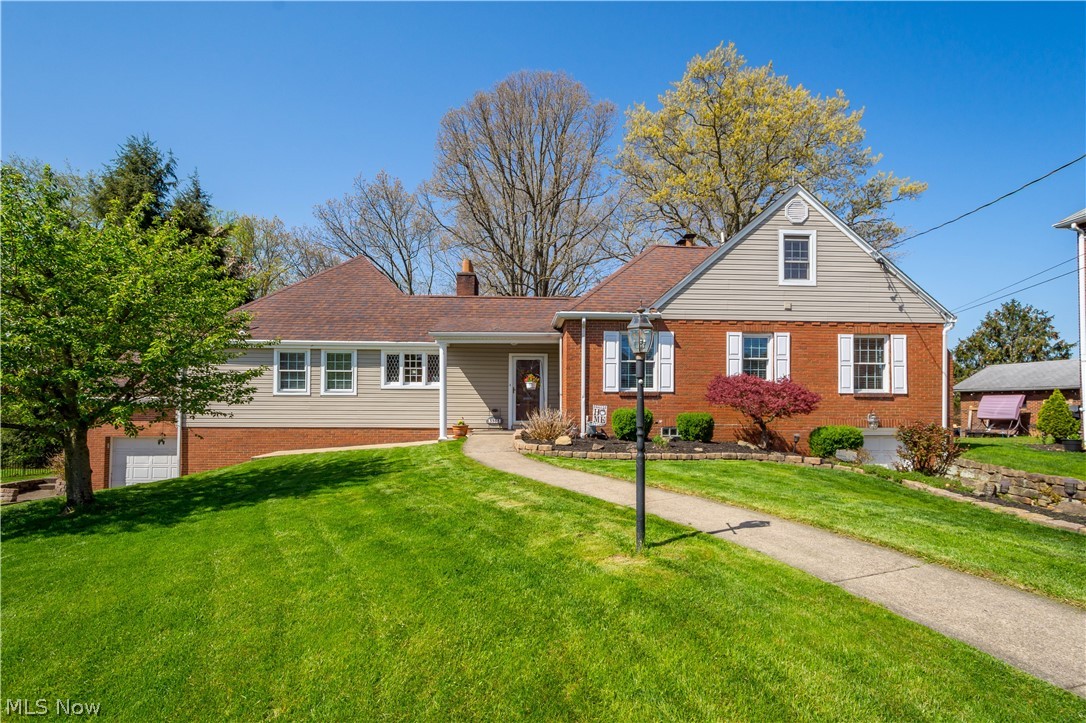 MAJESTIC AND GRAND. This 4 bedroom, 4 bath (2-full and 2-1/2) home, located on Marland Heights and situated on 3 lots that total .9 acre, with views of the Ohio River, is a classic beauty inside and out. Enter into the large slate foyer that leads to a gracious living room with fireplace that connects to the traditional dining room and equipped kitchen that all make for a great space entertaining family and friends. There are 3 bedrooms on the main floor with a spacious 24x23 Primary Suite with gorgeous hardwood flooring, bonus room and private bath with tons of natural light, walk-in shower, garden tub and double sink. The upper level has a 31x12 4th bedroom with half bath. A generously sized recreation room and half bath is located in the lower level perfect for game day, holidays or just relaxing. Other amenities include a private covered back patio, tons of storage throughout, 2 car garage and so much more. Truly a must see.
