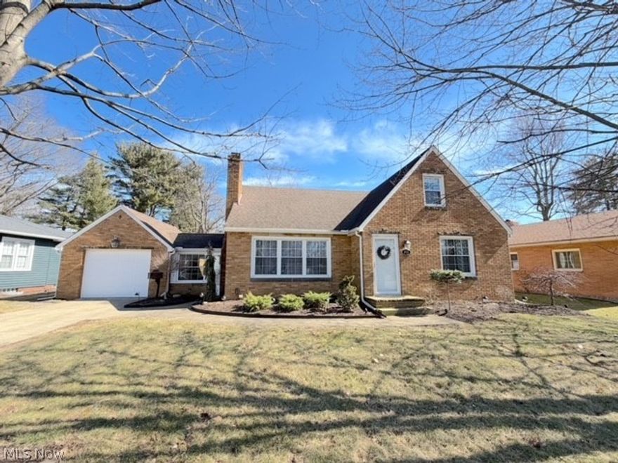 Charming brick home in a peaceful park-side setting. This beautifully remodeled 1 1/2 story home is in a quiet setting just steps away from Tuscora Park. From the moment you walk in you will be impressed with the spacious living room with a wood-burning fireplace. The totally remodeled kitchen features a center island, quartz countertops, new custom soft close cabinetry, and all newer stainless-steel appliances. The main floor bathroom has also been remodeled with fresh contemporary touches and a ceramic tile tub/shower enclosure. The main floor has 2 bedrooms, both with hardwood floors, and the 3rd bedroom is upstairs with 2 walk-in closets and a bonus area that could be a perfect home office. The lower level has an additional full bath along with a large family room with a gas fireplace and built-in bookcases. There is a mudroom that leads out to the 1 car attached garage with a brand-new garage door opener. There is a large 72x150 private fenced in back yard with a storage shed perfect for pets, kids, and quiet evenings at home. With classic brick curb appeal, modern updates, and a prime location, this home truly offers the best of comfort and convenience.