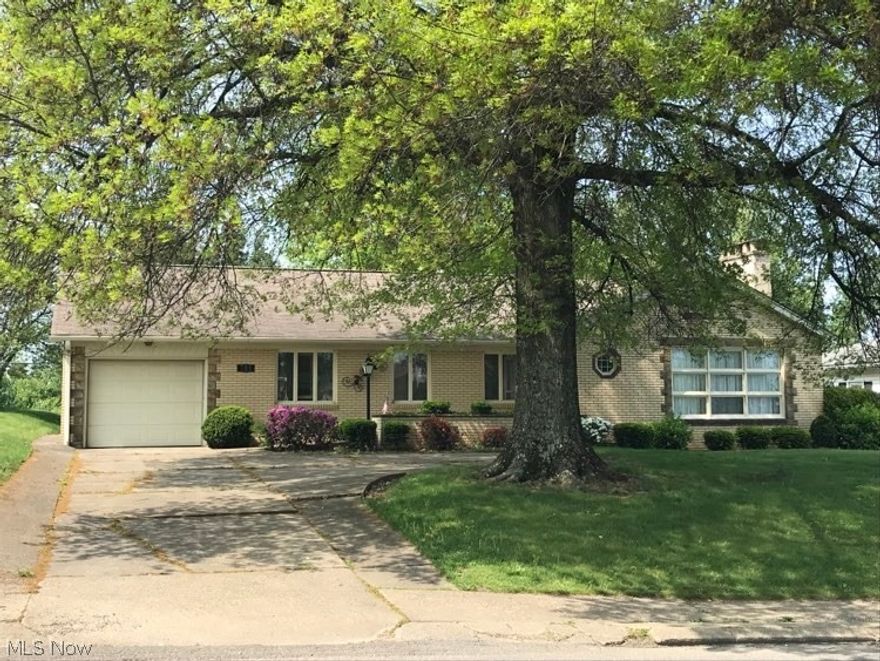 Homes like this don't hit the market very often! This well-built three-bedroom all brick ranch home with a one-car attached garage boasts stunning hardwood floors throughout and large inviting rooms. The oversized living room, complete with a brick gas fireplace, opens to a dining area with custom built-in cabinets and an expansive view of the backyard.  There are lots of possibilities in the fully finished basement which is currently one large room (plus a workshop area) with laundry and a second kitchen area. Just off the upstairs kitchen, an enclosed sunroom and extended patio overlooks the secluded and level backyard. Make this attractive house your new home!