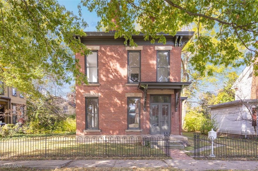 Welcome to this stunning brick colonial built in the Queen Anne Victorian style, located less than a mile from UH Elyria Medical Center and Elyria High School. This home has been restored to its original charm, but with some new modern touches. The house boasts beautiful original wood floors throughout most of the house and brand new carpet in other areas. The kitchen has brand new cabinets,  counters and stainless steel appliances. The bathroom is equipped with a brand new soaking tub/shower and new vanity and toilet. The living room is very large and adorned with high ceilings and wood floors. On top of the 3 upstairs bedrooms, there is also a first floor office. The electrical has been upgraded with a new panel in the basement and a new mast upgrading to 220 amp service outside. Also a brand new A/C has been installed to go along with the newer Furnace. The outside is very tranquil and has a nice back patio for entertaining. The Master Bedroom has a walkout covered back porch, perfect for sipping a glass of wine while enjoying a rain storm! The original carriage house still stands and is being used as a garage with a completely repaired original slate roof. Do not wait long to see this beauty as it will not last long!!