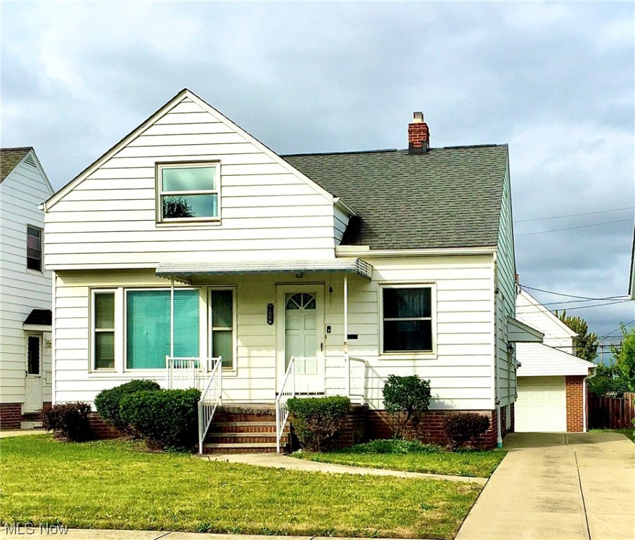 You'll want to see this charming bungalow with gorgeous hardwood floors! Pride of ownership shows in this well cared for home! The kitchen is large and has a separate dining area to accommodate your dining table! The original cabinets are painted white and there is a refrigerator and stove for your cooking needs. There are 2 bedrooms on the first floor with the full bathroom and 1 very large bedroom on the second floor. You'll enjoy relaxing on the front or back porches! There are vinyl replacement windows and glassblock in the full basement. Driveway was replaced in recent years and the two car garage has a newer floor along with remotes! This home is tucked away yet close to all the amenities! Schedule a showing today and make this your new home.