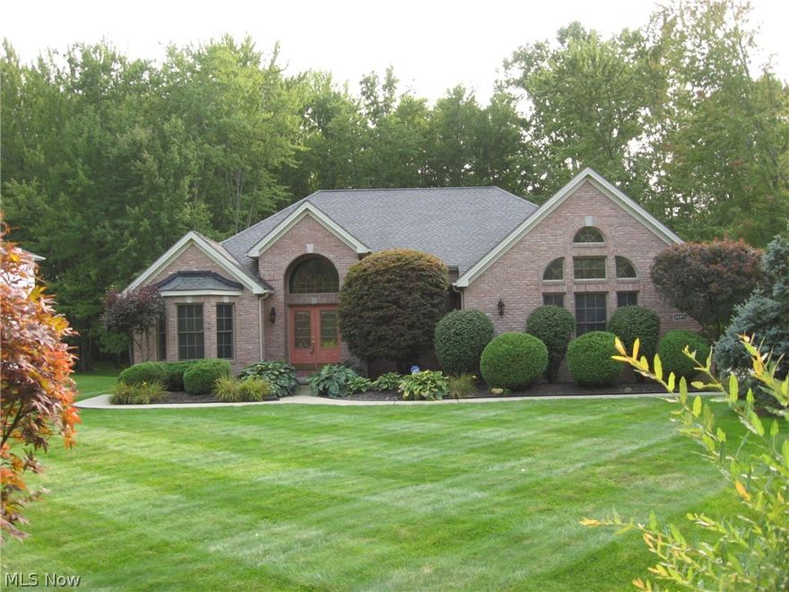 Custom built home with loads of loads of upgrades:  Huge, open floor plan with high and vaulted ceilings.  Wide-open living area includes great room, morning room area and gigantic, eat-in kitchen.  Formal dining room. Split bedroom design.  Walk-in, jetted bathtub, upgraded appliances, three-car, side-load garage with basement access (two stairs to basement), furnace and A/C replaced 2017, first flr laundry, sprinkler system, "his" suite even has a urinal! Three TV's, wall mounts, entertainment system throughout house stays with home.  Custom blinds.  Gigantic, full basement with high ceilings could be finished to your taste.  Whole house generator back-up system.  Sump pump has battery back-up too.  Professionally landscaped yard with sprinkler system.  High performance composite deck with roll-out awning.  Wooded, private rear yard.  Olmsted Falls Blue-Ribbon schools.  One-of-a-kind.  Truly a wonderful, well-card for home.  Be first or be sorry.  Olmsted Twp has no R.I.T.A. tax.