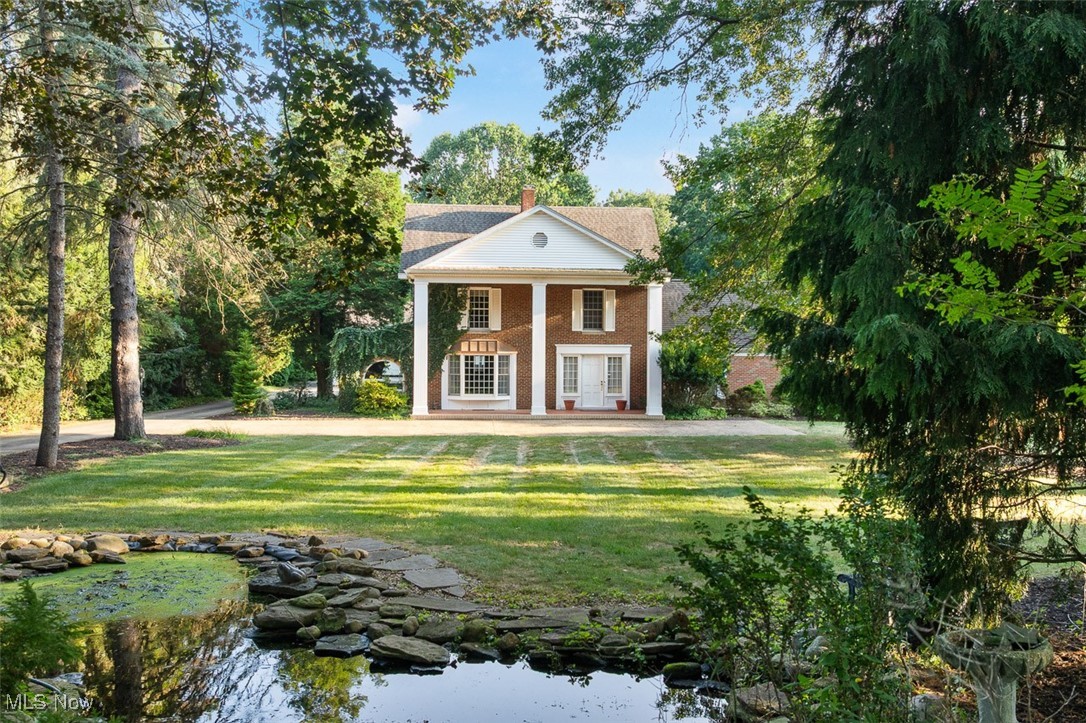 Beautiful Colonial Home On 7 Acres, 6,750 Sq. Ft., 5 Bedrooms, 4.5 Baths, Secluded Wooded Setting, 38’X38’ Barn/Garage, Development Potential, North Canton City, North Canton City Schools.ABSOLUTE AUCTION, all sells to the highest bidder on location. Live Auction with Online Bidding Available. ONLINE BIDDING BEGINS TUESDAY, SEPTEMBER 23, 2025, at 12:00 PM, and AUCTION LIVE ON-SITE BIDDING WILL BEGIN FRIDAY, SEPTEMBER 26, 2025at 12:00 PM. This beautiful colonial-style home offers over 6,750 sq. ft. of finished living space, 5 bedrooms, 4.5 baths, a 38’x38’ barn/garage, and sits on 7 wooded acres filled with privacy, wildlife, and development potential.Family owned for 41 years, owners have downsized! The main level features a grand foyer, open oak kitchen with Corian countertops, stainless steel appliances, hardwood floors, and built ins. The kitchen flows into a three-season room and a hot tub lounge room with private full bath, opening directly to the backyard and pool area. Additional spaces include a living room with stone fireplace, executive office or den, half bath, and a vaulted family/rec room with gas fireplace and sliding doors to the backyard covered patio. The second floor, accessible by two staircases, offers two bedrooms with full bath plus a luxurious master suite with fireplace, huge walk-in closet, and a master bath featuring double vanities, soaking tub, and tiled shower. A laundry area completes the level. The third floor provides two additional bedrooms and a full bath, ideal for guests or extended family.