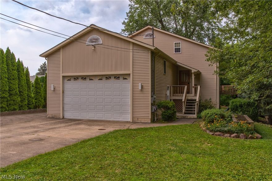 Custom built, one of a kind 5 bedroom, 4 full bath home located at the end of the cul-de-sac on gorgeous lot! Enjoy natures beauty from your private deck with built-in hot tub overlooking woods and stream. This unique home offers many options for your family. On the main level off the kitchen is a bedroom with french doors (the owner currently uses this as a dining room). You can also find a full bath and laundry room on this level as well. The second floor has two bedrooms and a loft, overlooking the two story great room and fireplace. The lower level features a workout room, kitchenette, fireplace, bedroom and bathroom.  Over the garage is a complete in-law / teen suite with private entrance (or access through main house). This additional living suite offers a bedroom, family room, private bath and a kitchen. Both the lower level and garage suites have access to a second laundry area. This is not your average floor plan. Must see to appreciate this one of a kind home.