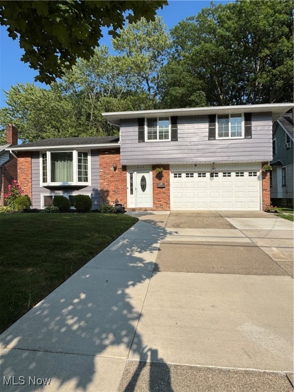Welcome to YOUR next home! This well-maintained BEAUTY will not last long! This hidden gem shines brightly even amongst the most beautiful homes in the Bedford neighborhood. This home boasts an open floor plan that welcomes you in-it has a spacious living room with a new bay window that offers beautiful natural light and a beautiful brick accent wall- the formal dining room walks out to an enclosed back sunroom looking out to a gorgeous backyard. The formal dining room connects to the kitchen and includes stainless-steel appliances-showcases quality cabinetry, granite countertops and a breakfast bar. The second level has three nice-sized bedrooms and a full bath. The lower finished level offers additional entertainment space perfect for family gatherings and football Sundays -it connects to a laundry/mechanical room. Step outside to enjoy a spacious backyard with a composite fence bench, a cement patio that is perfect for entertaining, additional storage shed for tools, and a garage that was converted to a private man cave that is perfect for poker night! Recent upgrades include: concrete patio and walkway 2019; new front bay window 2020; updated half-bath and granite countertops 2022; carport added 2022; painted entire house 2024; leaf filters 2024 (lifetime warranty); front driveway widened with concrete 2025; composite backyard bench 2025. This move-in ready home checks all the boxes. Don't miss your chance to own this charming Bedford gem! One year warranty included!