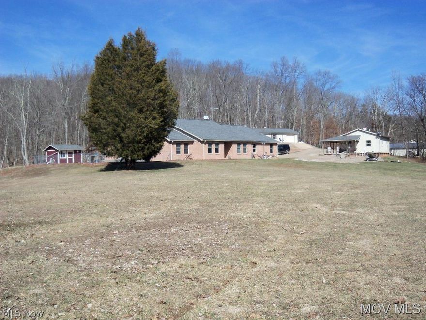 Private secluded setting, 41 & 1/2 wooded acres. Stocked pond with island & bridge.One level no steps,4 Bedrooms 2 & 1/2 baths,both baths have jetted tubs. Master also has a steam shower.A 23x35 great room, formal dining room,and den. Built in patio area overlooks playground, picnic area & pond. In ground heated pool with slide, has an electric powered safety cover. 1 bedroom guest house with 1 car garage. Multiple buildings for shops, studios & equipment. A must see to appreciate all this has to offer.  Elem: Little Hocking Elementary Scho  Elem/Bus: Y  JrHigh: Little Hocking Middle  JrHigh/Bus: Y  High: Warren High School  High/Bus: Y  Fire: VOL  Police: SHF  PossFreeGas: N  ;SQFT=Fin L1:2458, Fin Above:2458, Fin Total:2548, Unfin Above:0;GAR= 1 Car Built In, Gar Other-See Remarks