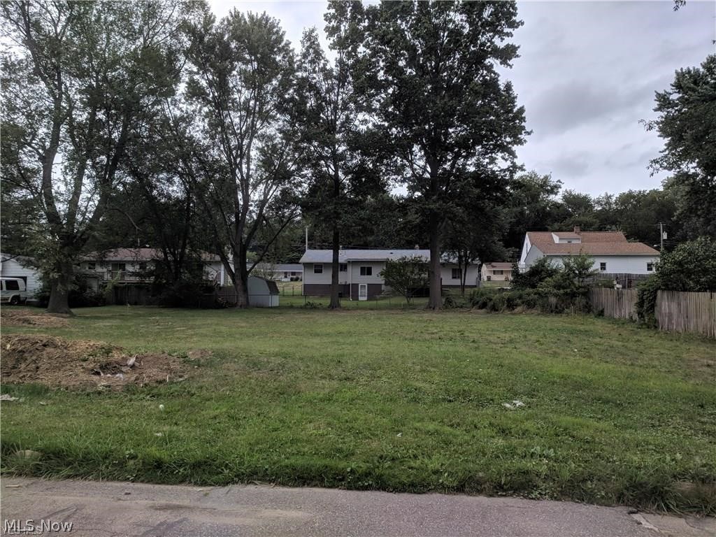 Nice buildable residential lot Priced well and ready to build, zoned single family that has 90 foot frontage and is 118 ft in depth. All utilities are at the street. As the story goes a very small house was located on the far right corner of the lot that burnt down, after the fire, derbies was professionally removed and typically they remove the top few feet of the block foundation, punch out the flooring and then back filled. According to Chip at Akron building department this lot is acceptable to build on. Good value buy here.