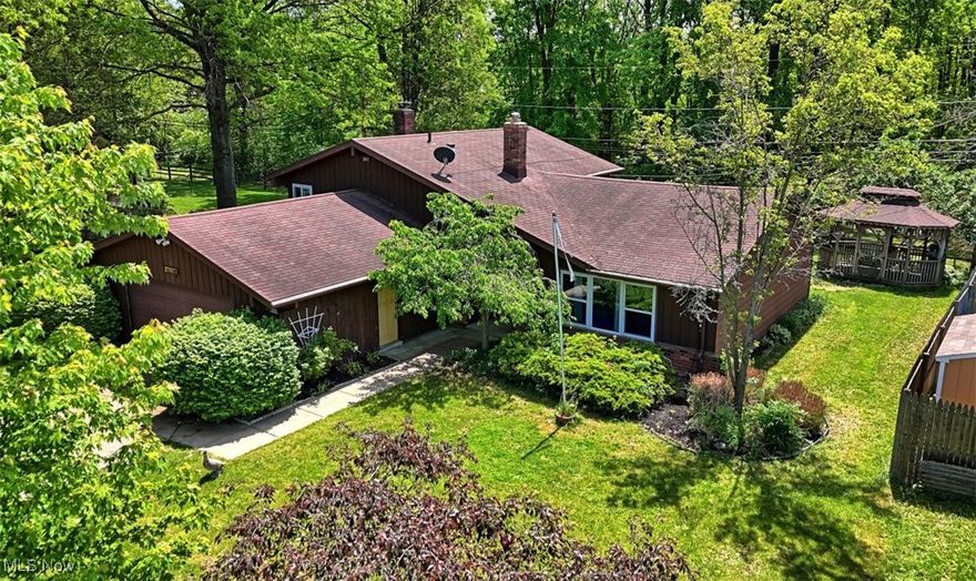 Welcome home to this charming 4-bedroom, 2 full bath split-level home located in the heart of North Olmsted. Nestled in a quiet, established neighborhood, this property offers both comfort and privacy in an ideal setting. Step inside to find a spacious and versatile floor plan perfect for family living and entertaining. Recent updates include luxury vinyl tile (LVT) flooring in the kitchen, offering both durability and modern style, as well as elegant ceramic tile in the dining room that adds a touch of sophistication. The home features four generously sized bedrooms and two full bathrooms. Upstairs, you'll find the inviting master suite, complete with direct access to the full bath, a makeup vanity area, and a generous walk-in closet. Two additional bedrooms complete this level, offering flexibility for family, guests, or hobbies. Downstairs from the foyer, the cozy family room centers around a gas-burning fireplace. Off the family room is a full guest bath, the fourth bedroom is currently used as an office. The backyard is a secluded retreat bordered by mature trees and a wooded lot, providing a peaceful, natural backdrop. Enjoy quiet mornings or evening gatherings under the charming gazebo, making this outdoor space perfect for relaxing or entertaining guests year-round. Additional updates: roof (approx. 2017) windows (approx. 2014) With easy access to parks, shopping and major highways, this home offers the perfect blend of convenience and serenity. Don't miss your opportunity to own this lovely North Olmsted gem!