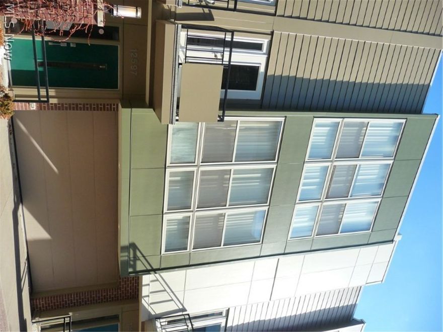 Sealed bid reserve auction. List price is the starting bid price at auction. Auction date (June 8) is the deadline for bids but an offer could be accepted at any time so submit your offer ASAP.  Built in 2006 and rebuilt in 2015, this condo is ready for years of worry free living by it's next owner. Originally built at a cost in excess of one hundred & thirty thousand dollars higher than the auction starting bid number, making a great opportunity for one smart buyer. City living with a chic, modern flare and all the amenities today's discerning buyers demand: inc. granite countertops, stainless steel, fireplace, open floor plan and upscale kitchen. Balcony off living room giving access to the open air. Upper floor has a rooftop deck and panoramic views of the surrounding Cityscape. Secure private parking in your own attached garage. Tax abatement for approx 5 more years. Come explore this awesome like-new unit offered way below the cost to replicate it. Make your offer today and reap t