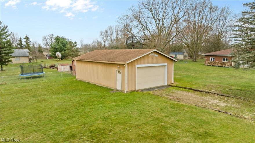 What a wonderful place to call home!! All the boxes are checked. 1st we have updated eat in kitchen with breakfast bar, stove, frig, microwave, spacious living room with fireplace, 3 bedrooms, master bedroom is huge, 1 full and one half bath, to the lower level a 2nd kitchen and dining area is wonderful with stove and frig also, rec room and family room adds plenty to the wonderful square feet, also so includes laundry and much storage to work with, let's talk garages, attached 2 car plus a wonderful pole building/work shop/garage with electric. Yes hold 4 plus cars depending on size, wonderful corner lot, just over half an acre, covered front porch, small fenced area in back. All sizes, ages and square feet estimated